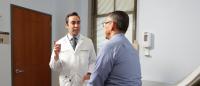 A doctor speaks with a patient.